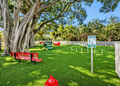 Thumbnail 37 of 40 - A park with a red fire hydrant on the grass.