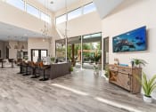 Thumbnail 15 of 17 - a lobby with a reception desk and chairs and a large window