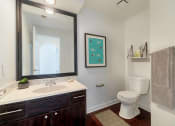 Thumbnail 11 of 22 - a bathroom with a toilet sink and a mirror