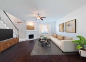 Thumbnail 9 of 22 - a living room with a couch and a tv