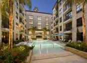 Thumbnail 22 of 23 - a large swimming pool in the middle of an apartment building
