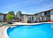 Thumbnail 17 of 27 - a swimming pool in front of a house with a pool
