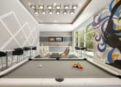 Thumbnail 22 of 44 - a billiards room with a pool table and chairs