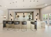 Thumbnail 17 of 44 - a kitchen with bar stools in front of a large mirror