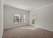 Thumbnail 6 of 26 - an empty room with carpet and a door to a window