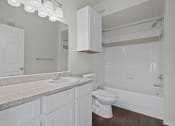 Thumbnail 8 of 26 - a bathroom with a sink toilet and a bath tub