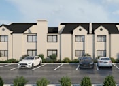 Thumbnail 13 of 19 - A rendering of a building with a parking lot in front.