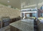 Thumbnail 32 of 34 - Outdoor kitchen with grills