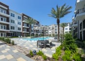 Thumbnail 28 of 34 - pool with patio furniture and landscaping