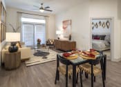 Thumbnail 3 of 34 - model apartment living room and dining area