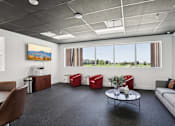 Thumbnail 8 of 31 - A modern office space with a view of the outdoors.