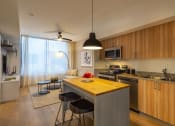 Thumbnail 1 of 37 - a kitchen and living room with a large island in the middle