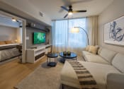 Thumbnail 2 of 37 - a living room with a couch and a tv