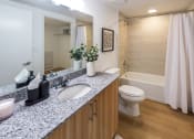 Thumbnail 17 of 37 - a bathroom with a sink and a toilet