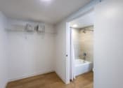 Thumbnail 10 of 37 - a bathroom with a shower and a bath tub in it