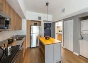 Thumbnail 7 of 37 - a kitchen with stainless steel appliances and a wooden counter top
