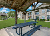 Thumbnail 23 of 30 - our picnic tables are under a covered pavilion with our apartments in the background