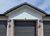 Thumbnail 29 of 30 - a garage door on the side of a house