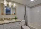 Thumbnail 12 of 36 - a bathroom with a sink toilet and a shower
