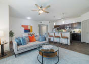 Thumbnail 3 of 36 - a living room with a couch and a coffee table