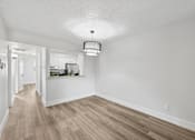 Thumbnail 12 of 38 - A room with a light brown floor and white walls.