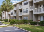 Thumbnail 18 of 19 - an apartment building with balconies and palm trees