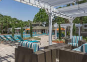 Thumbnail 16 of 19 - a pool with lounge chairs and umbrellas at a resort