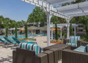 Thumbnail 13 of 19 - a pool area with lounge chairs and umbrellas