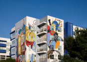 Thumbnail 9 of 24 - a building with a mural on the side of it