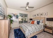 Thumbnail 1 of 39 - Bedroom with a bed at Woodbridge Villas Apartments, Sachse, TX, 75048