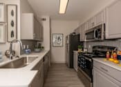 Thumbnail 2 of 39 - Fully equipped kitchen at Woodbridge Villas Apartments, Sachse, 75048