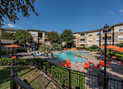 Thumbnail 15 of 39 - Swimming pool area at Woodbridge Villas Apartments, Sachse, TX