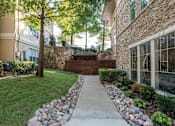 Thumbnail 39 of 39 - Stone pathway at Woodbridge Villas Apartments, Sachse, TX, 75048