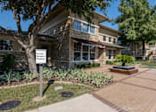 Thumbnail 34 of 39 - Front of the building at Woodbridge Villas Apartments, Sachse, Texas