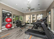 Thumbnail 31 of 39 - Well-equipped home gym at Woodbridge Villas Apartments, Sachse, Texas