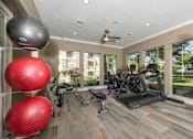 Thumbnail 29 of 39 - Gym with treadmills at Woodbridge Villas Apartments, Sachse, TX