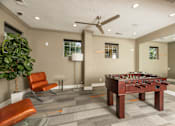 Thumbnail 23 of 39 - Clubroom with a foosball table at Woodbridge Villas Apartments, Sachse