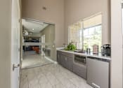 Thumbnail 24 of 39 - Clubhouse kitchen at Woodbridge Villas Apartments, Sachse, Texas