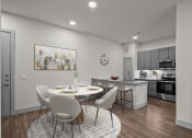 Thumbnail 10 of 34 - an open kitchen and dining room with a table and chairs