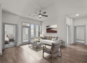 Thumbnail 11 of 34 - a living room with a couch and a ceiling fan