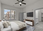 Thumbnail 12 of 34 - a bedroom with a large bed and a ceiling fan