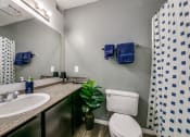 Thumbnail 21 of 36 - a bathroom with a sink toilet and a mirror