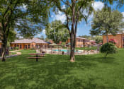 Thumbnail 29 of 36 - a backyard with a picnic table and a pool
