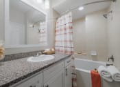 Thumbnail 14 of 54 - a bathroom with a sink and a bathtub
