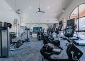 Thumbnail 33 of 54 - a large gym with cardio machines and other exercise equipment