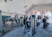 Thumbnail 32 of 54 - a gym with cardio machines and other exercise equipment