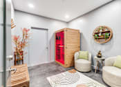 Thumbnail 30 of 50 - A room with a red door and a wooden cabinet.
