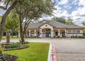 Thumbnail 22 of 22 - the front of a house with a parking lot and trees