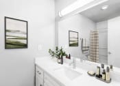 Thumbnail 25 of 25 - a white bathroom with a large mirror and a sink