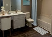 Thumbnail 13 of 22 - a bathroom with a sink toilet and a shower